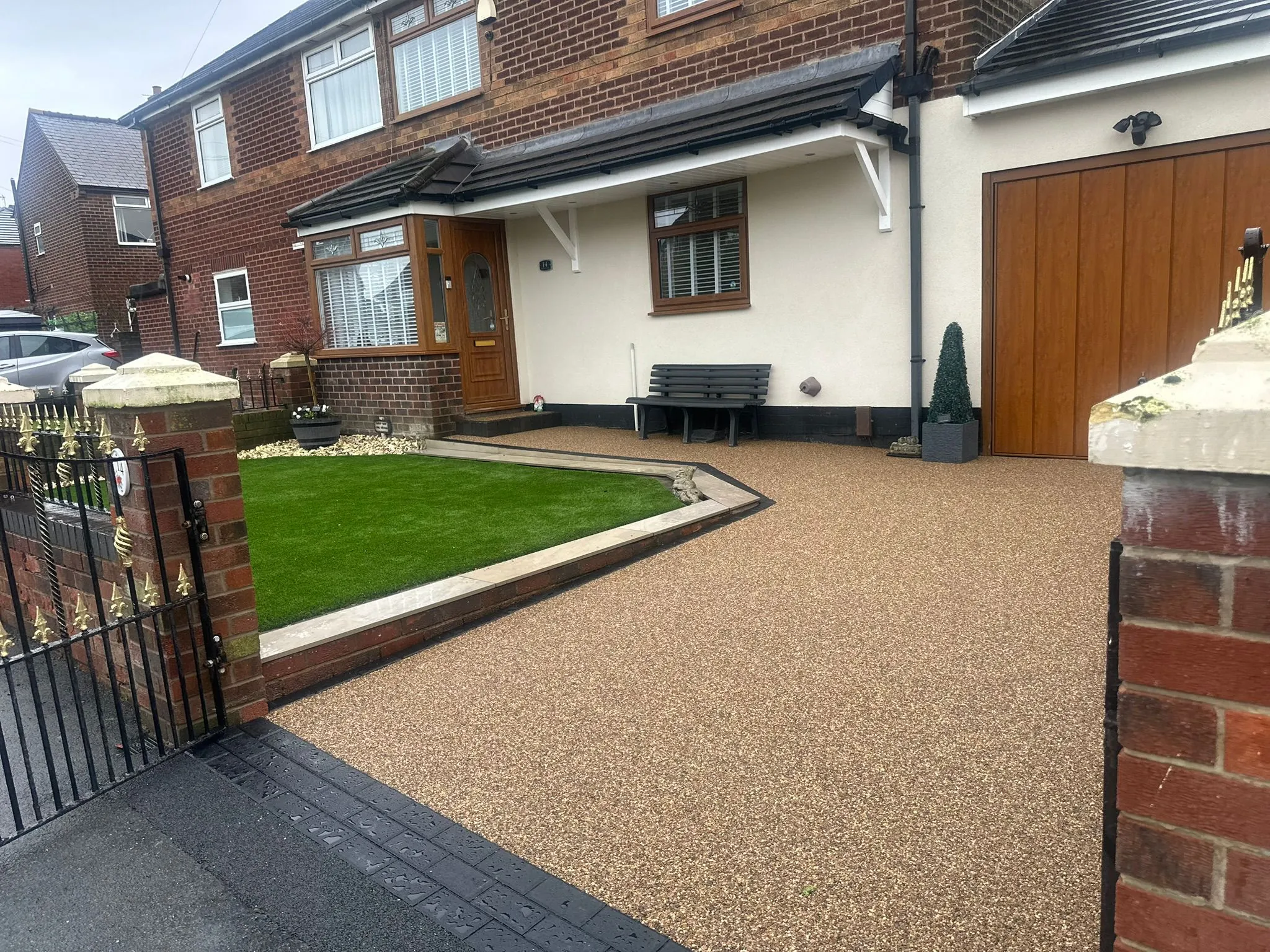 Bronze resin bound driveway at semi with front lawn