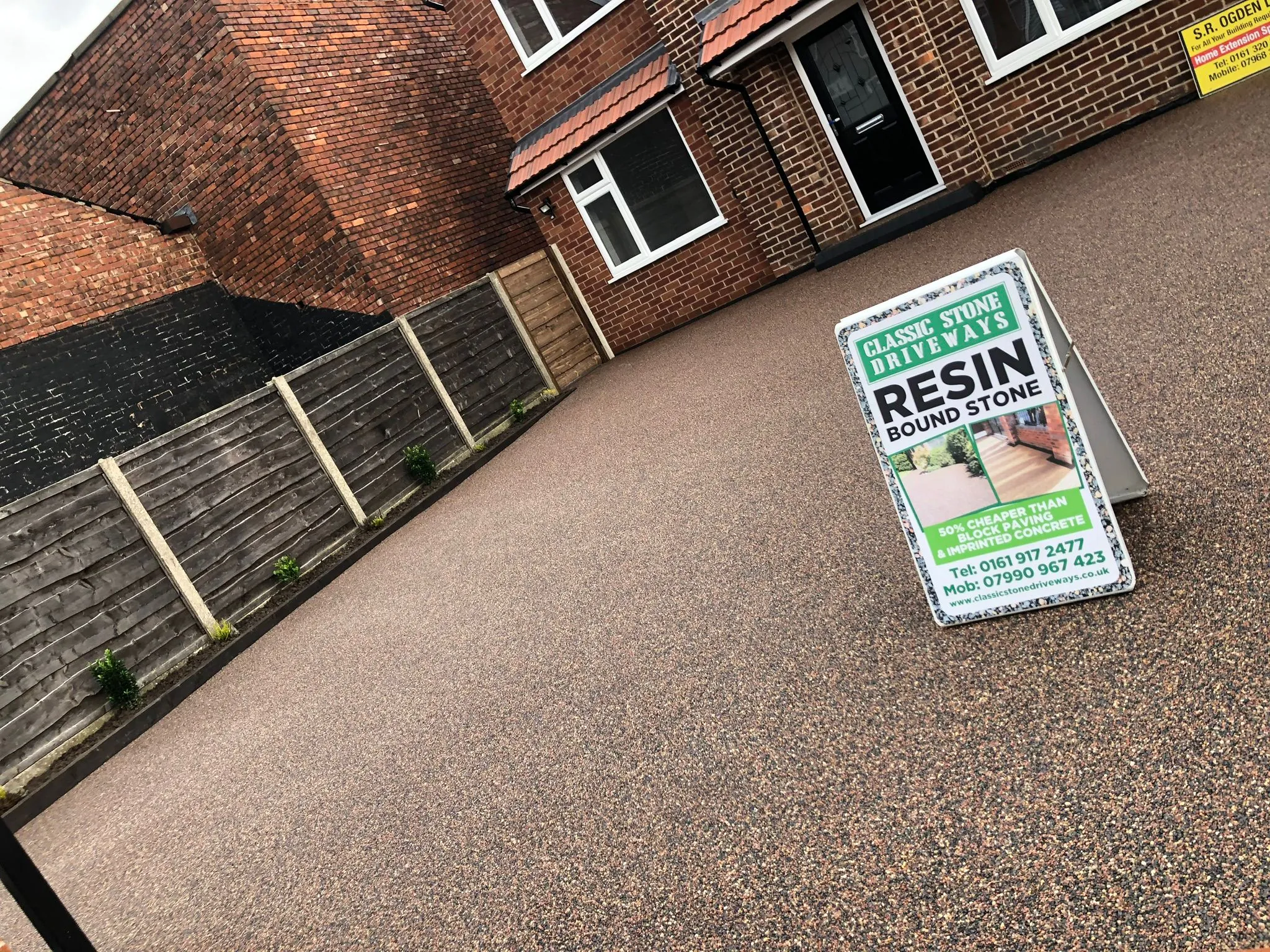 Bronze resin drive with Classic Stone Driveways signage