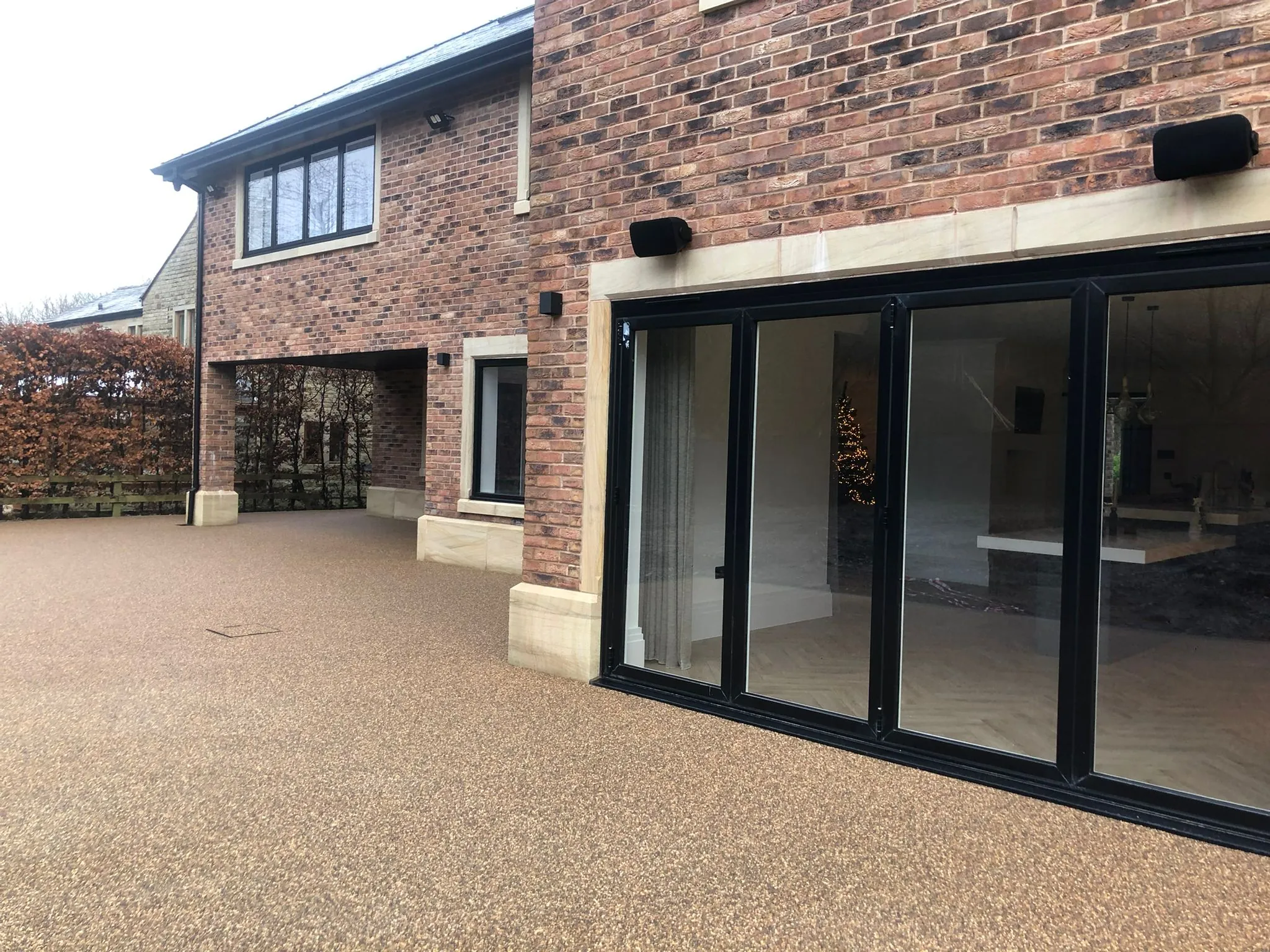 Bronze resin drive at contemporary brick home, Manchester