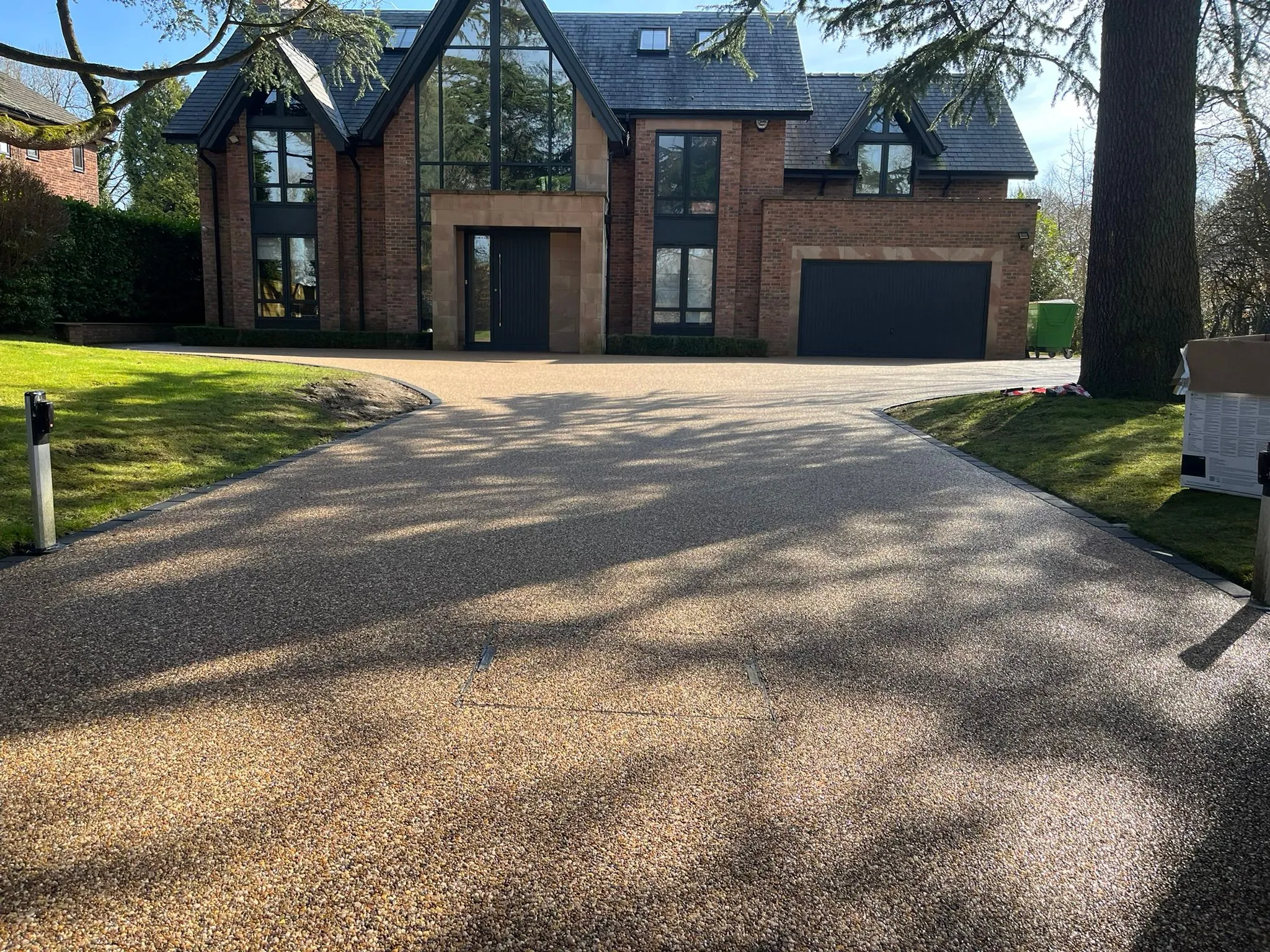 Bronze resin driveway at contemporary house, Manchester