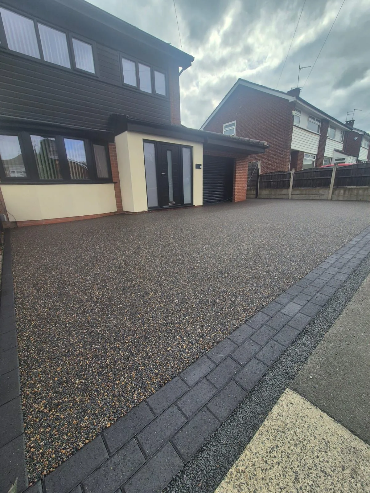 Bronze resin driveway at modern grey semi, Manchester