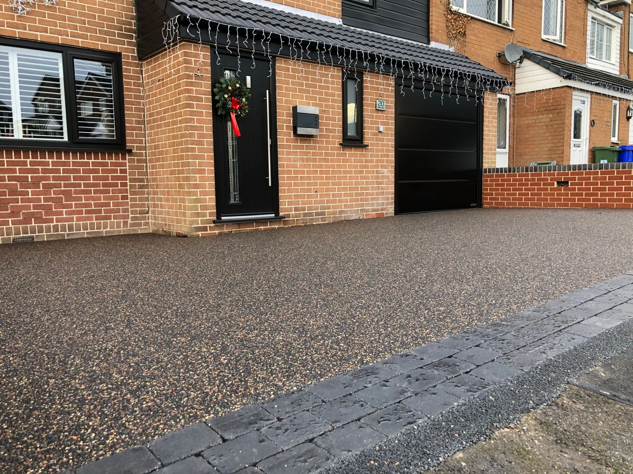 Bronze resin driveway at semi with Christmas lights