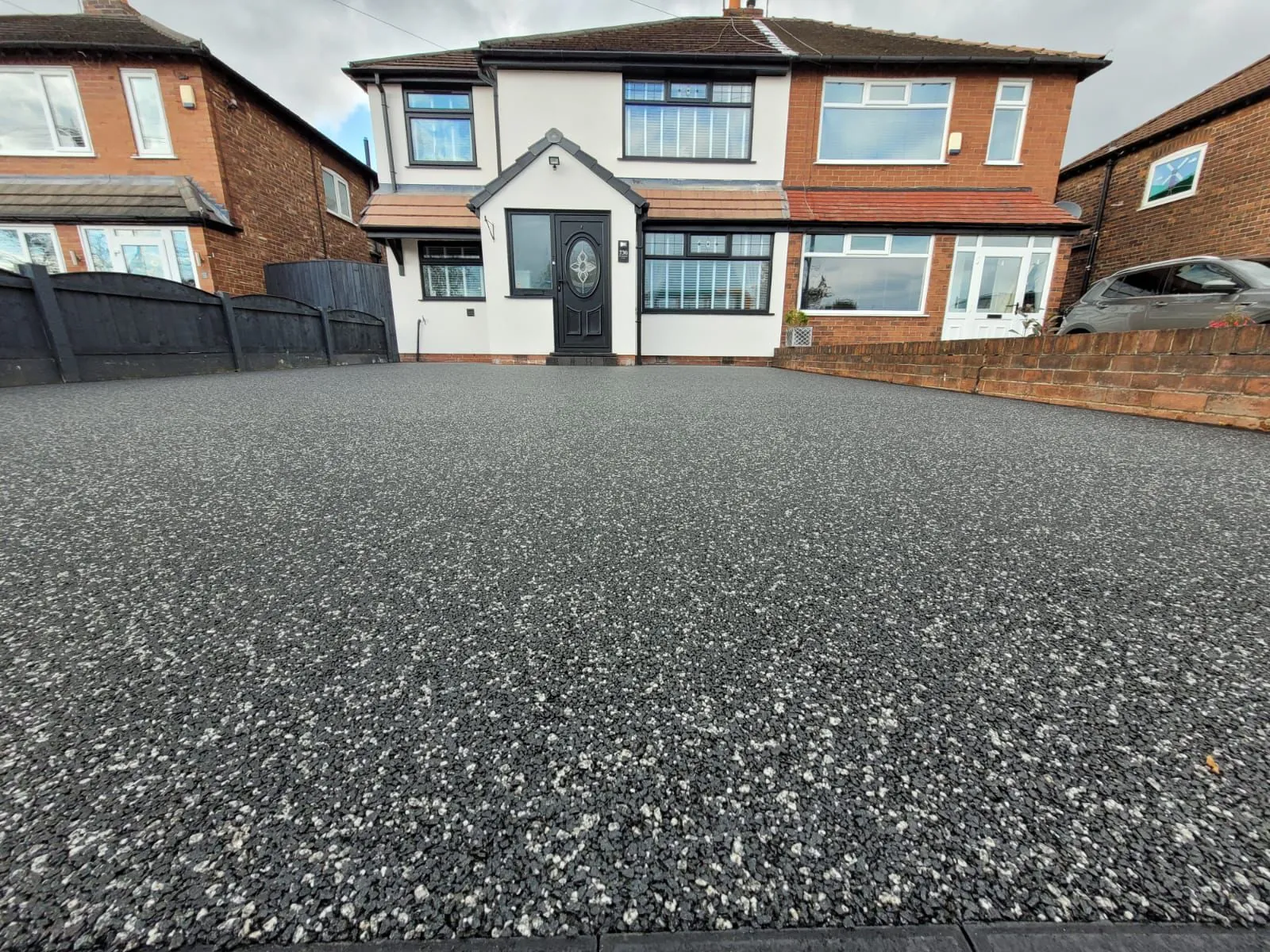 Charcoal resin bound driveway at semi-detached front, Manchester