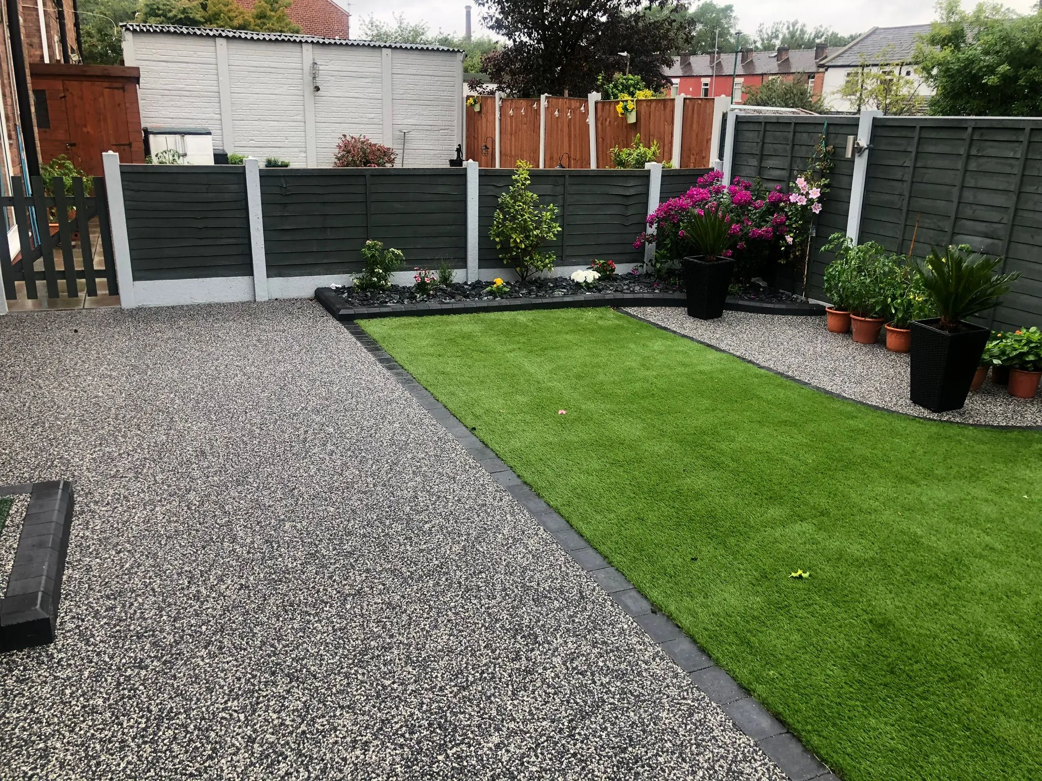 Charcoal resin drive with back garden and lawn