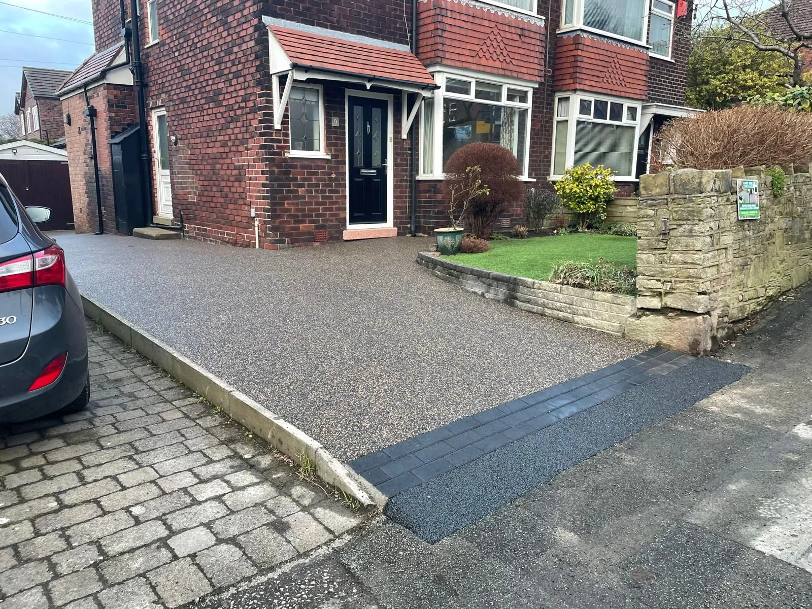 Charcoal resin drive at semi-detached with ramp access