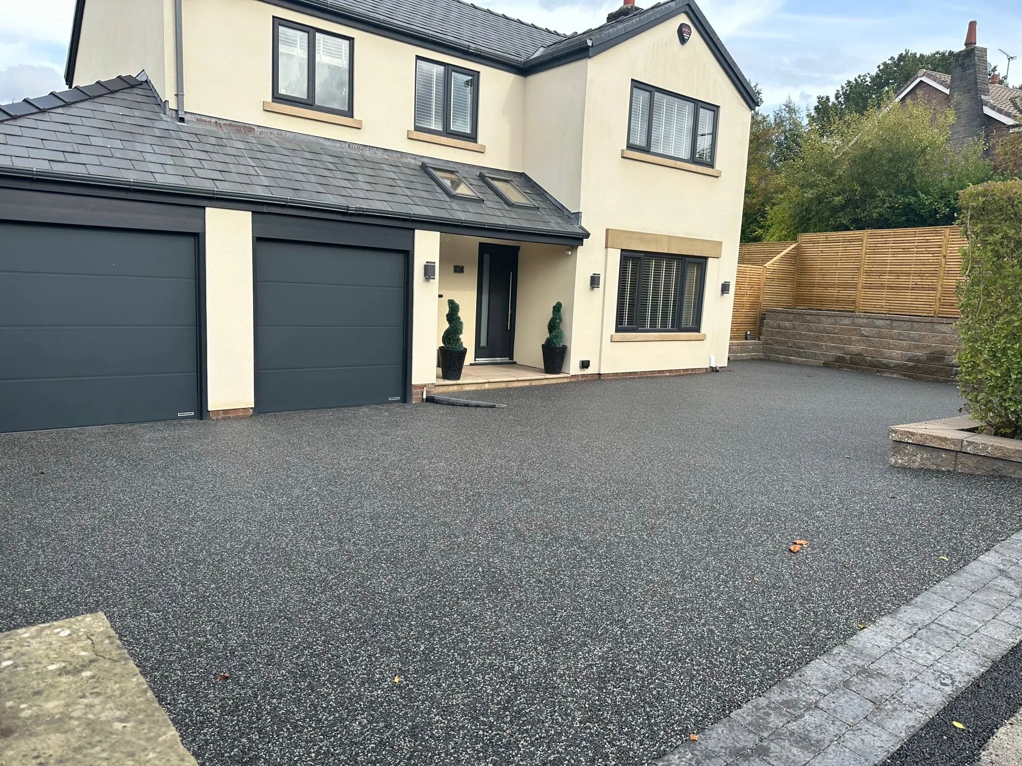 Charcoal resin driveway with double garage, Manchester