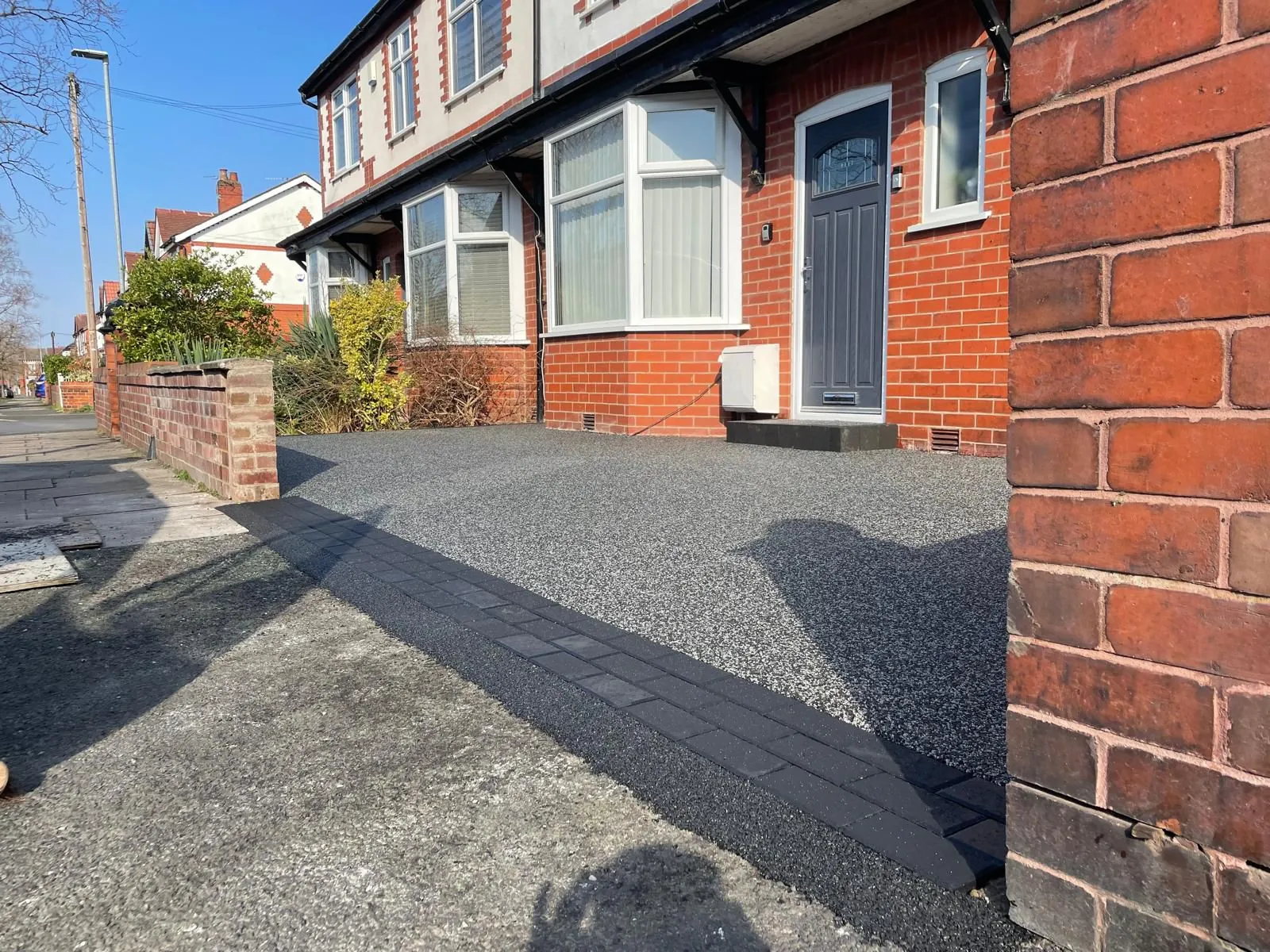Charcoal resin driveway at terraced brick house, Manchester
