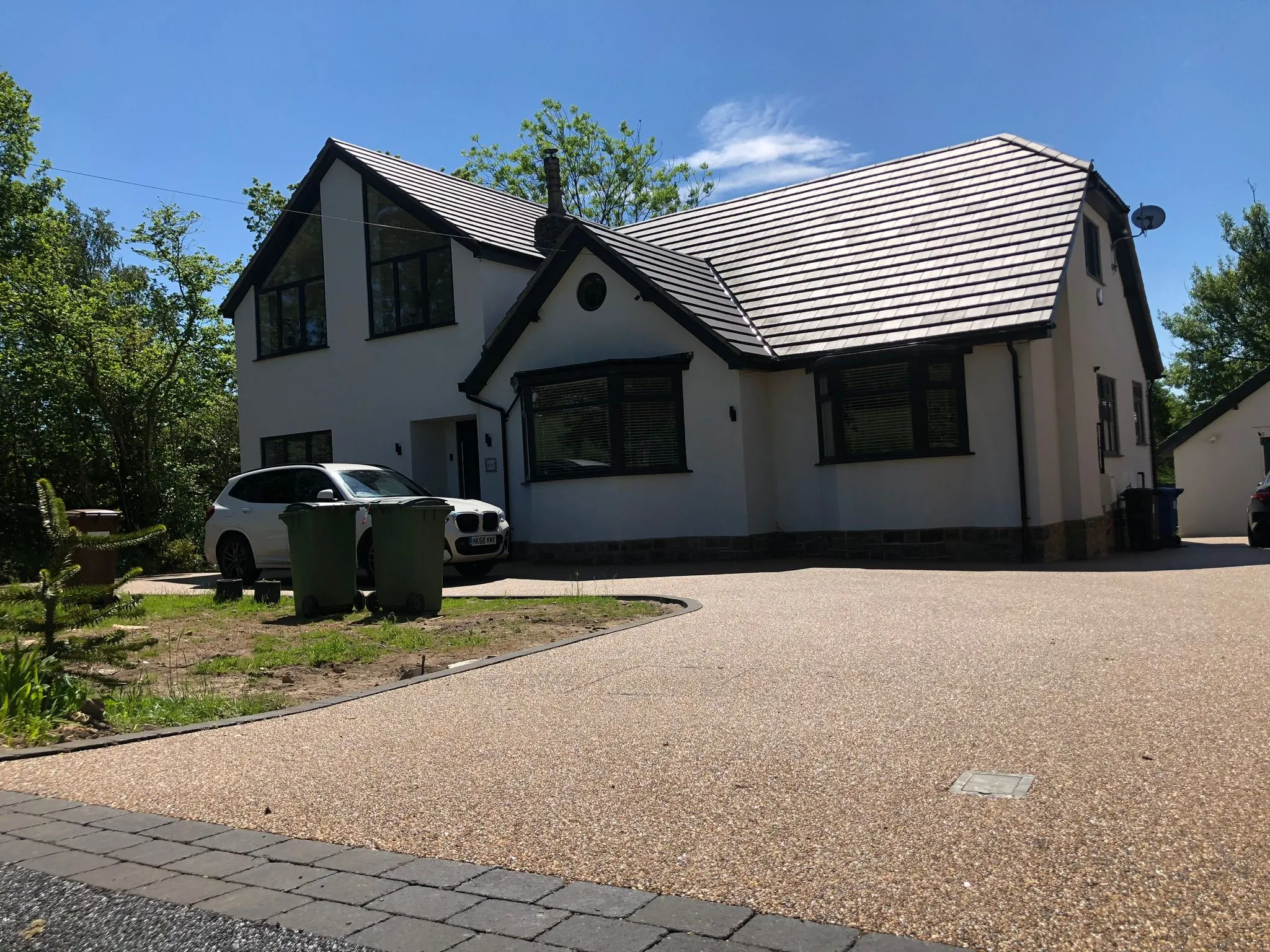 Completed copper resin bound driveway at a Tudor style home, Manchester