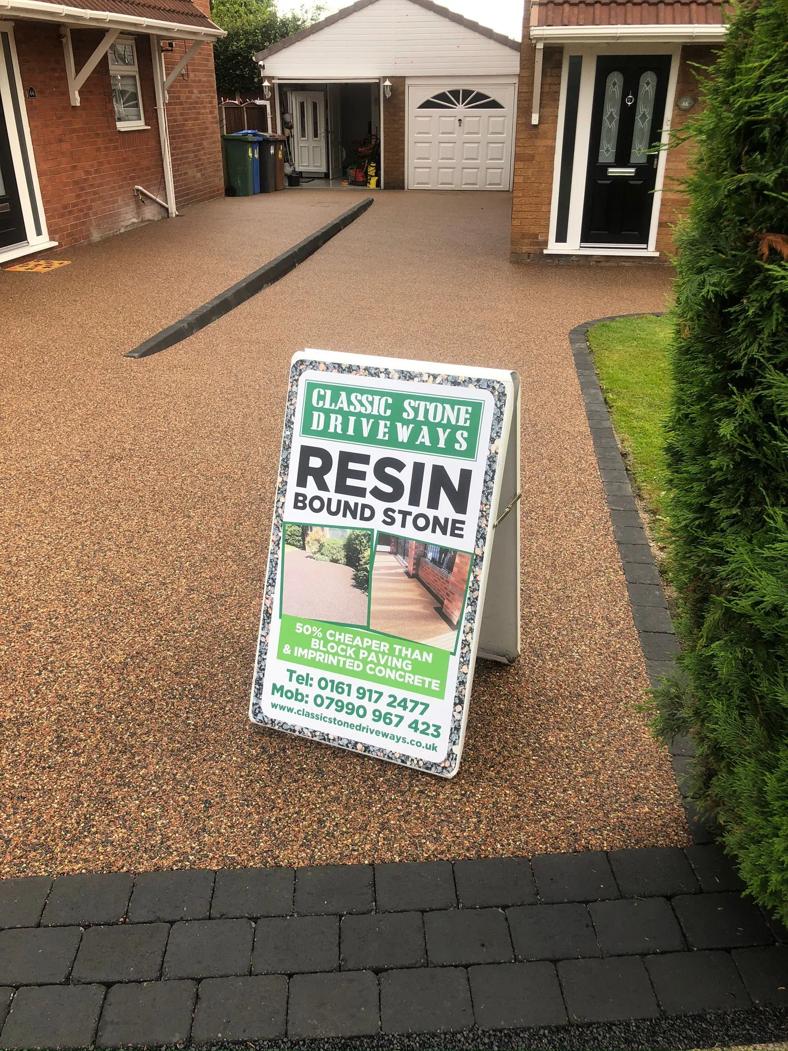 Copper resin drive with Classic Stone Driveways signboard