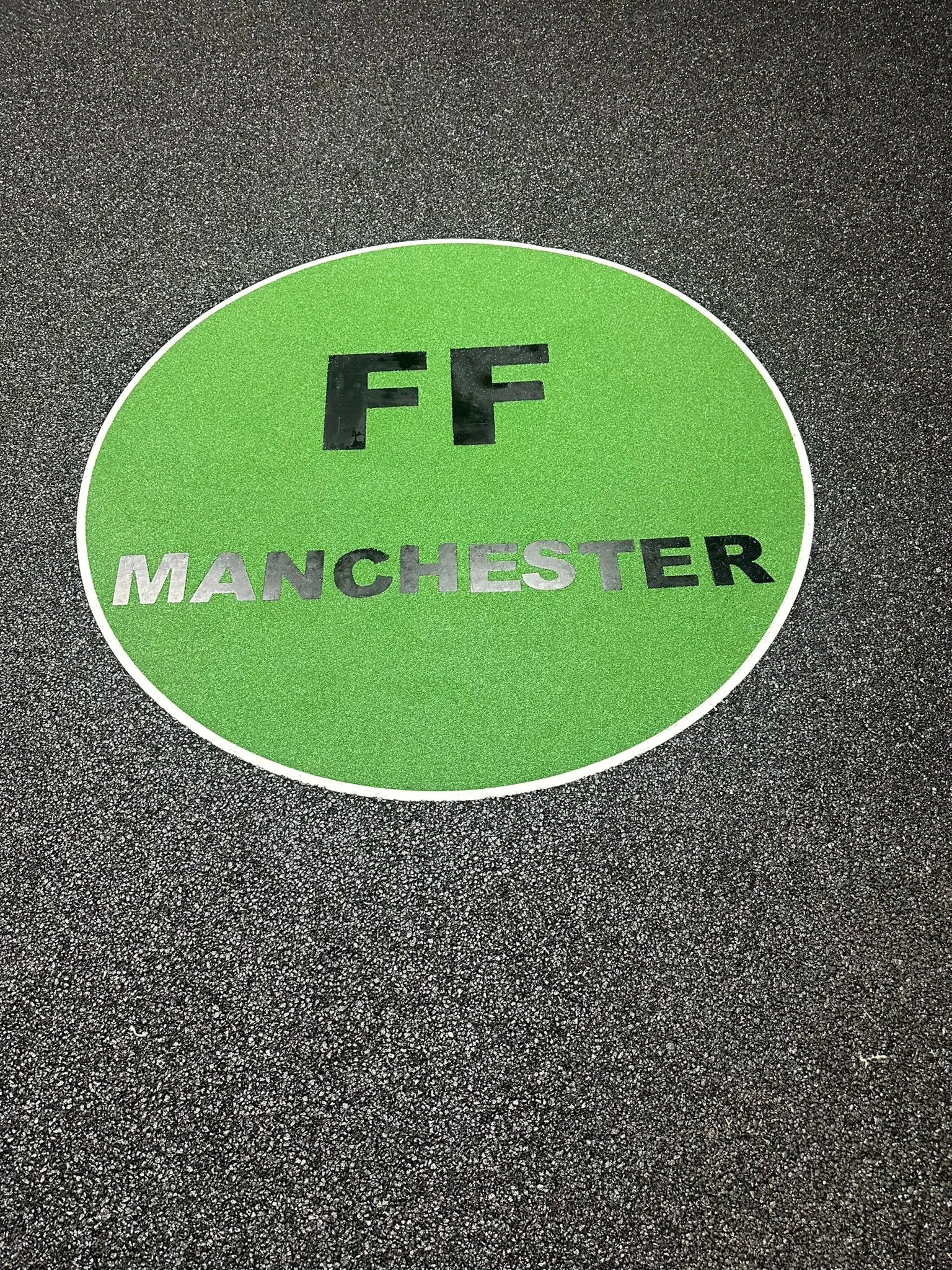 FF Manchester logo inlaid in resin driveway