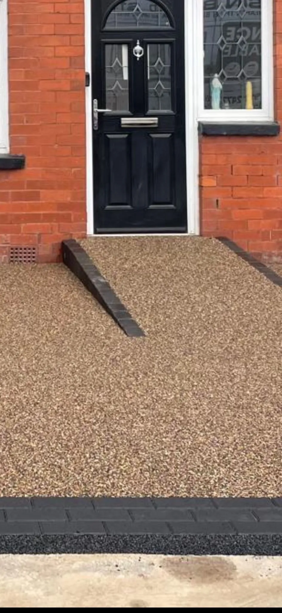 Golden resin doorstep at terraced house front