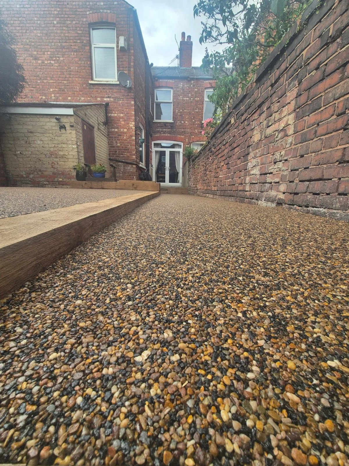 Golden resin drive side passage at Victorian home