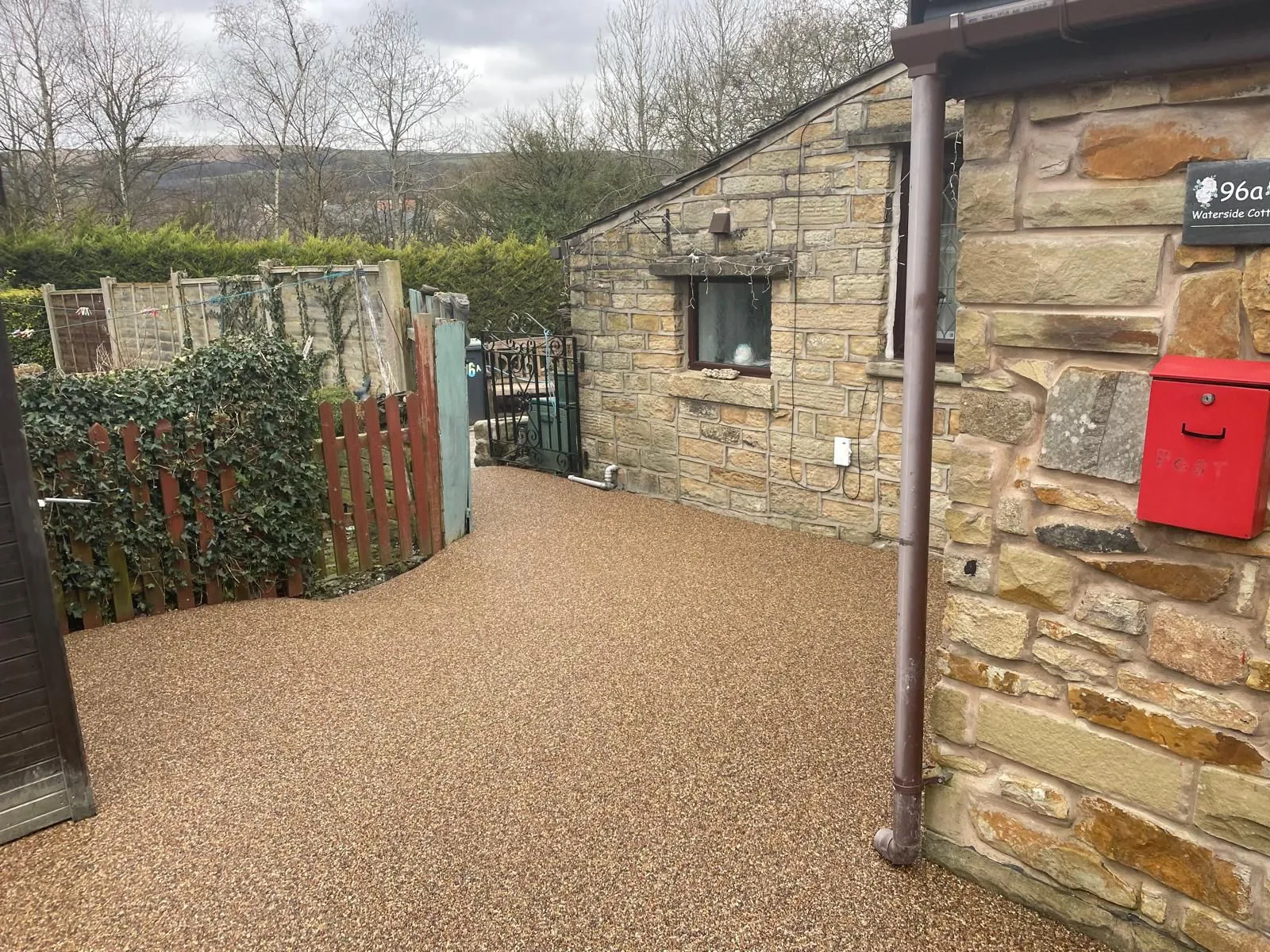 Golden resin bound driveway at a stone cottage, Manchester