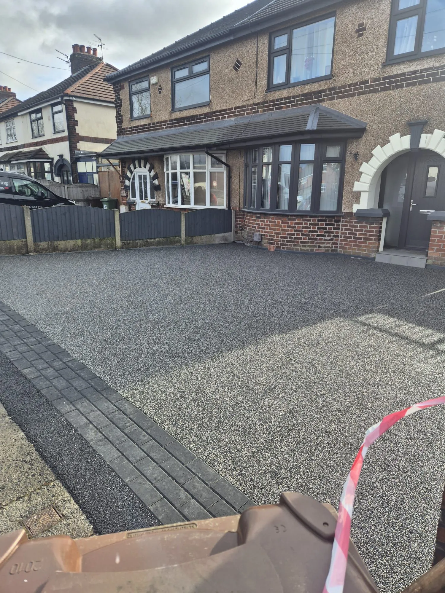Graphite resin driveway at bay-fronted semi-detached, Manchester