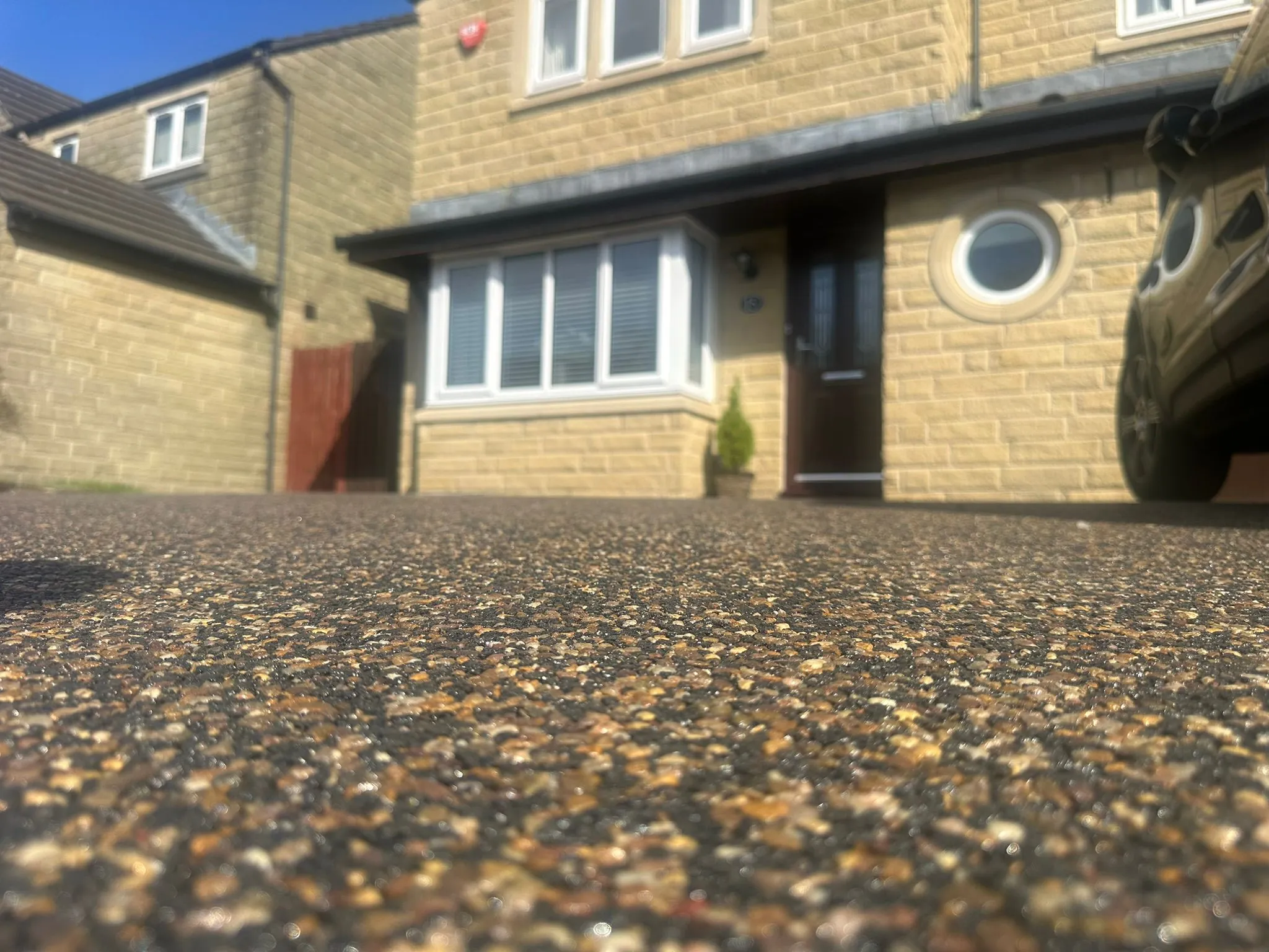 Honey gold resin driveway at stone house, Manchester