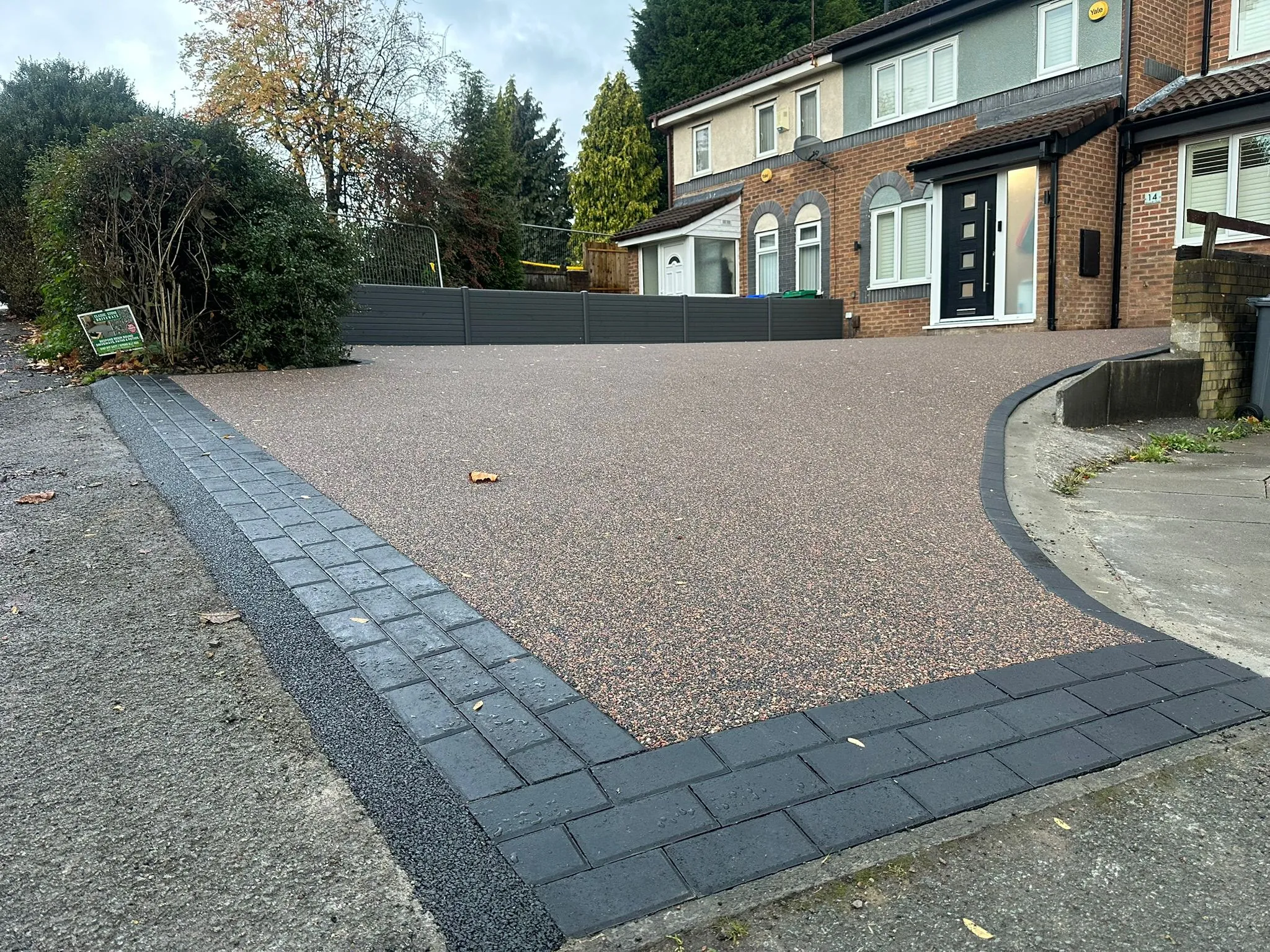 Red bronze resin driveway with block paved border, Manchester