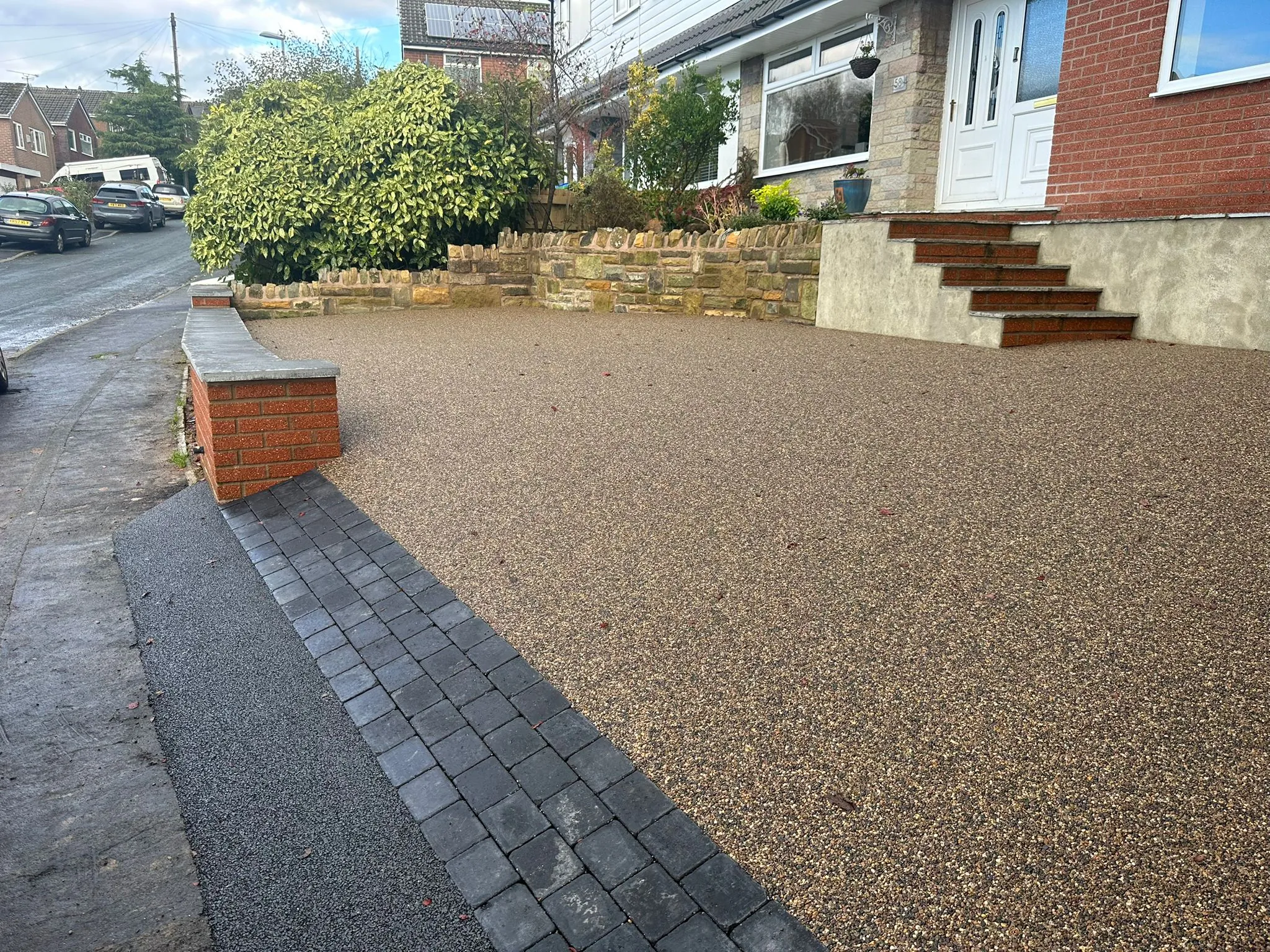 Russet resin drive, side approach to house, Manchester