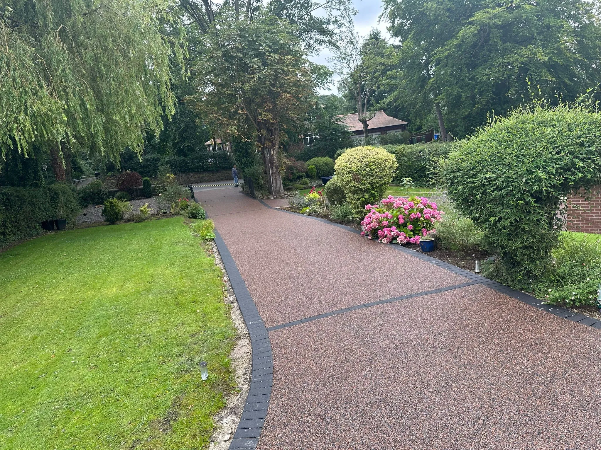 Russet resin driveway with garden path and flowers, Manchester