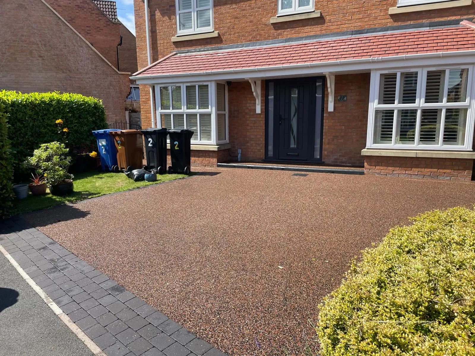 Russet resin bound driveway at a modern semi-detached home, Manchester