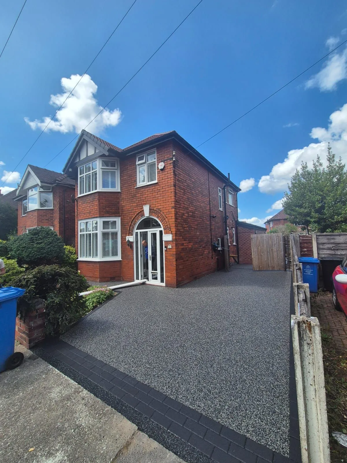 Silver resin driveway at detached red brick home, Manchester