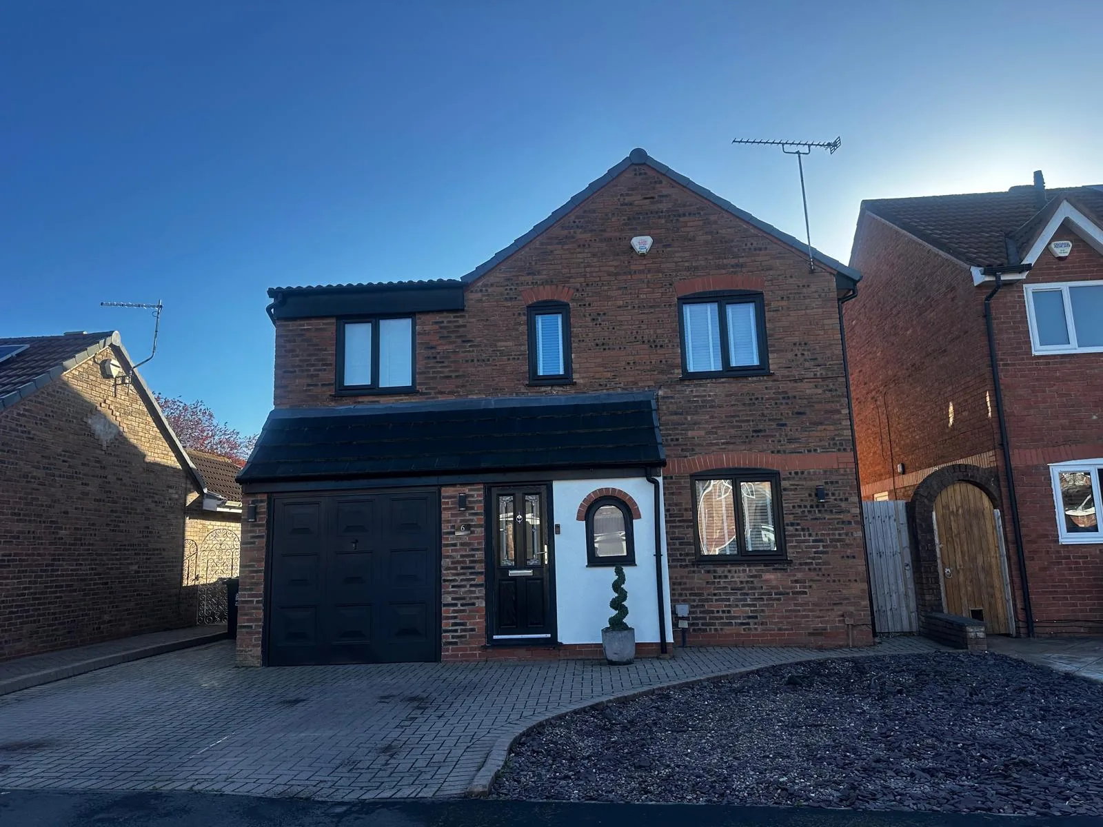 Charcoal resin bound driveway at a detached house, Manchester
