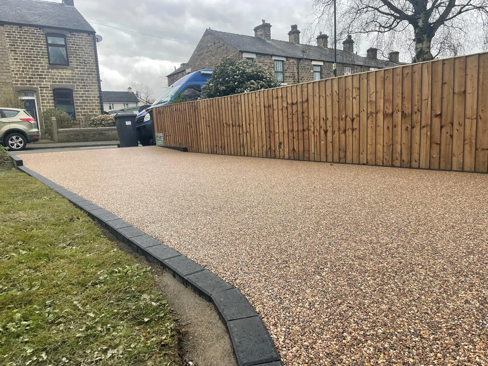 Golden resin bound driveway with lawn at a bungalow, Manchester