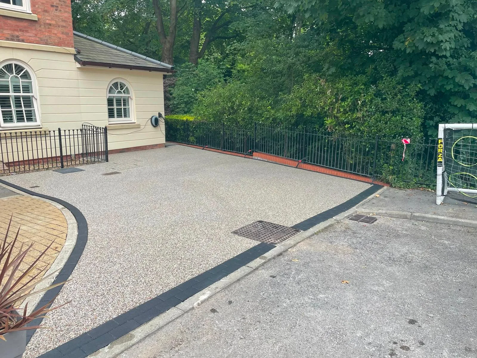Completed pearl gold blend resin bound driveway in Astley, Greater Manchester