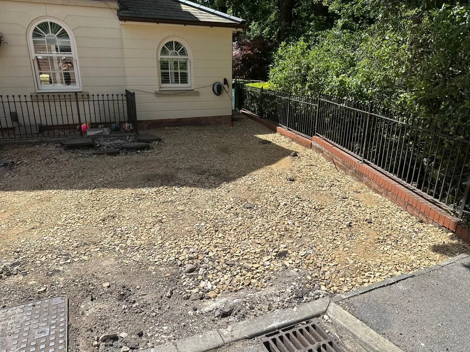 Worn gravel driveway before resin installation at a period home in Astley, Greater Manchester