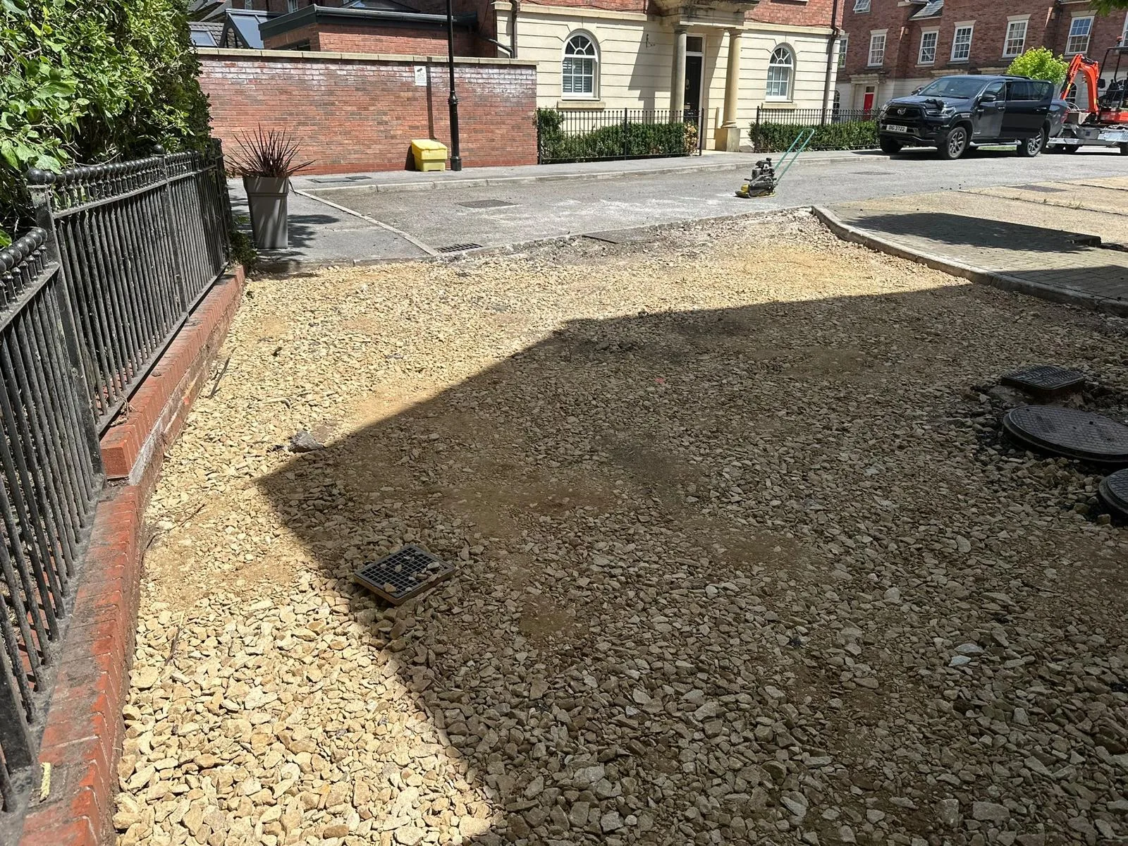 Excavated and compacted stone sub-base at the Astley driveway before resin