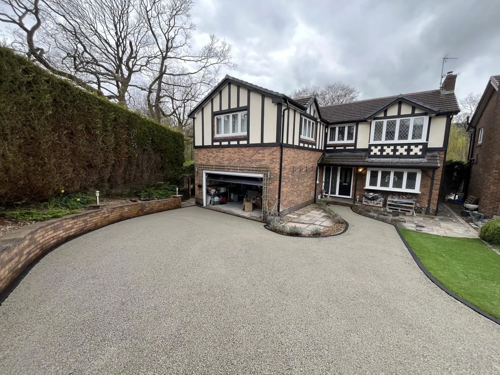 Compacted grey stone sub-base laid across the Glossop driveway before the resin was installed