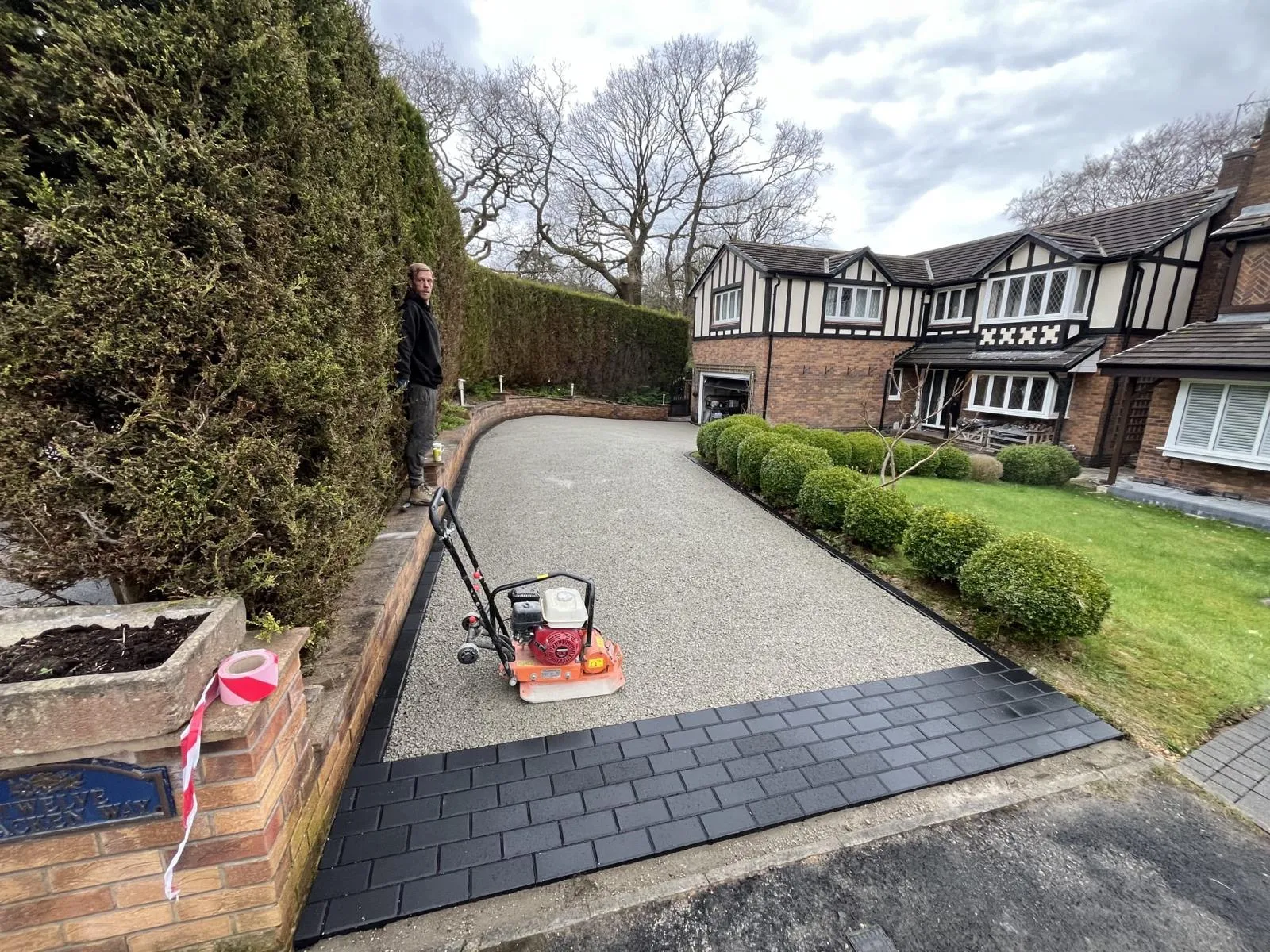 Compacting the stone sub-base of a Glossop driveway before the resin was laid