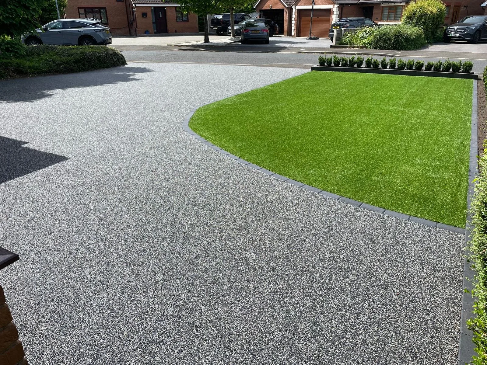 Silver resin bound driveway sweeping around a front lawn, Manchester