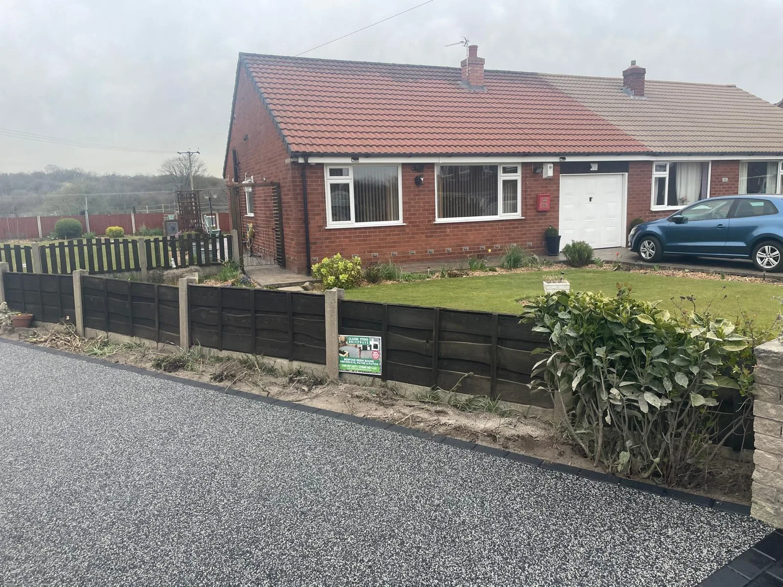 Silver resin driveway across a bungalow frontage, Manchester