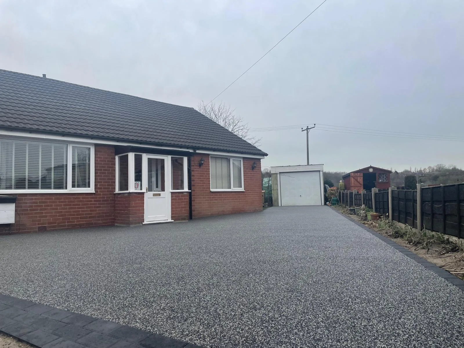 Silver resin driveway at a detached bungalow, Manchester
