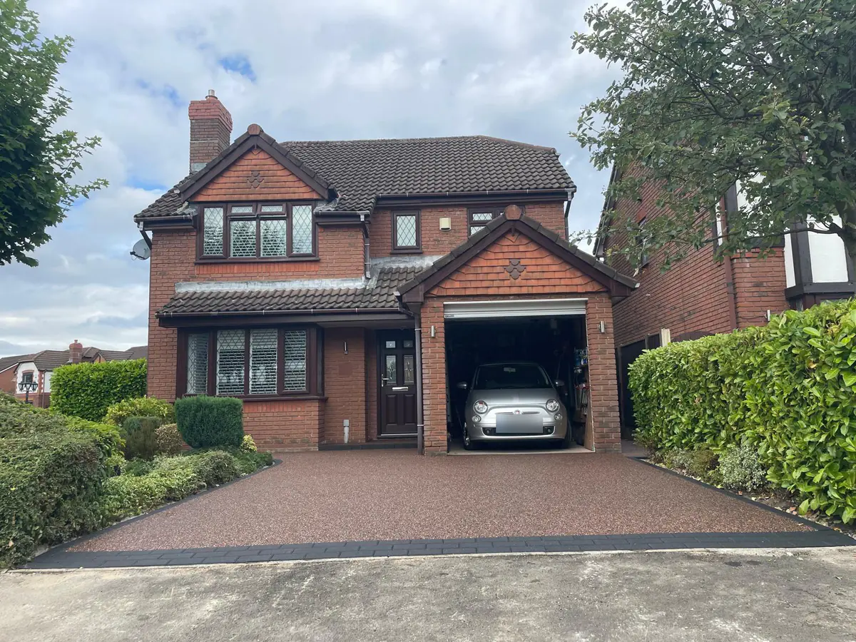 Rosegarden resin bound driveway running from the road to the garage in Denton