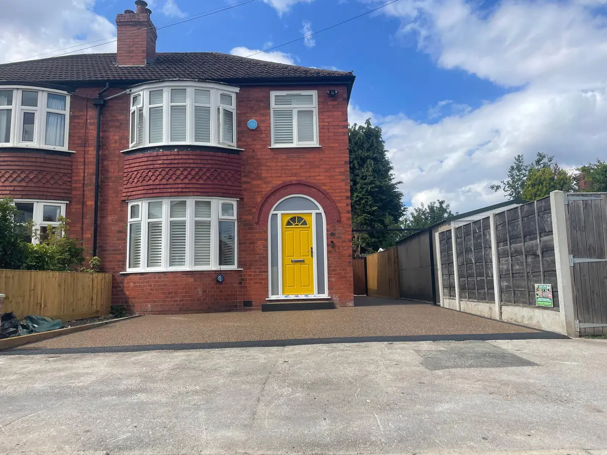 Brittany Bronze resin bound driveway at a bay-fronted semi in Heaton Moor