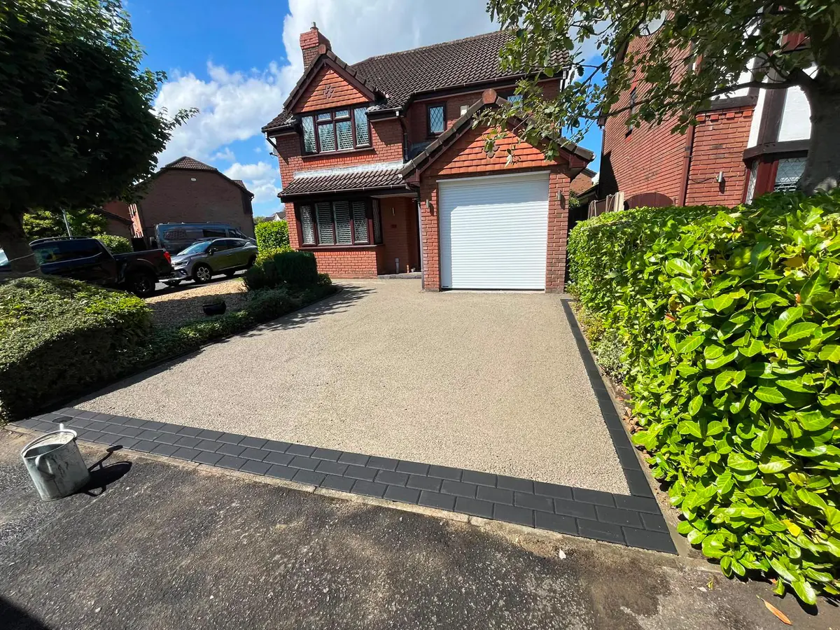Compacted stone sub-base with charcoal block edging laid