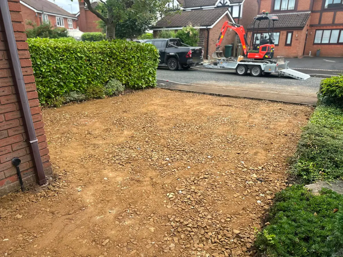Driveway excavated down to subgrade with a mini digger