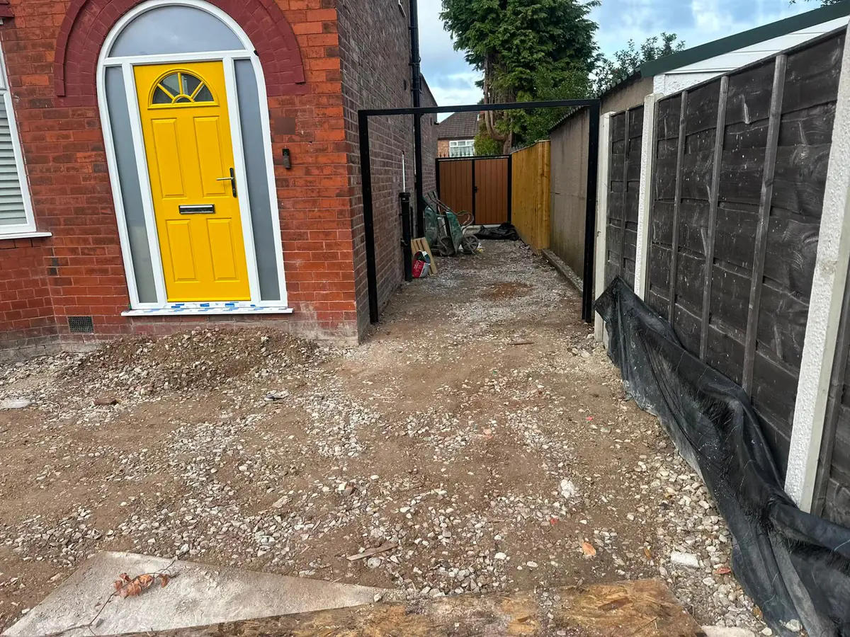 The Heaton Moor driveway dug out to subgrade, with the side passage opened up